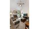 Comfortable living room features a fireplace, large windows and a vaulted ceiling at 596 Deadwood Trl, Locust Grove, GA 30248