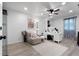 Bright home office with a ceiling fan, ample desk space, and stylish décor for a productive work environment at 596 Deadwood Trl, Locust Grove, GA 30248