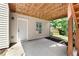 Cozy back patio area perfect for outdoor dining or relaxation, offering shade and a peaceful retreat at 596 Deadwood Trl, Locust Grove, GA 30248