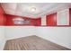 Spacious basement with wood-look flooring, beadboard accent wall, and light from a double window at 115 Jamie Dr, Hiram, GA 30141