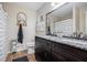 Bathroom features granite countertops, dark vanity, and framed mirror at 115 Jamie Dr, Hiram, GA 30141