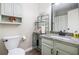 Bright bathroom with single sink vanity and decorative shelves at 115 Jamie Dr, Hiram, GA 30141