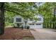 Charming two-story home featuring a well-manicured yard and a welcoming front entrance with a two-car garage at 115 Jamie Dr, Hiram, GA 30141