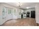 Charming kitchen with light green cabinets, black appliances, and wood-look tile flooring at 115 Jamie Dr, Hiram, GA 30141