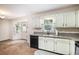 Traditional kitchen with white cabinets and granite countertops at 115 Jamie Dr, Hiram, GA 30141