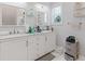 Bathroom with double sinks, marble countertops, and ample storage space at 1598 Jonesboro Se Rd, Atlanta, GA 30315