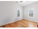 Clean and bright bedroom with hardwood floors, natural light, and a ceiling fan at 1598 Jonesboro Se Rd, Atlanta, GA 30315