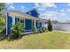 Charming two-story home with a blue exterior, landscaped yard and inviting front porch at 1598 Jonesboro Se Rd, Atlanta, GA 30315