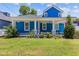 Charming two-story home with a blue exterior, inviting front porch, and well-manicured lawn at 1598 Jonesboro Se Rd, Atlanta, GA 30315