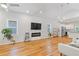 Spacious living room with hardwood floors, a fireplace, and modern decor at 1598 Jonesboro Se Rd, Atlanta, GA 30315