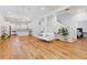 Bright living room with hardwood floors open to kitchen and stairway to second floor at 1598 Jonesboro Se Rd, Atlanta, GA 30315