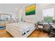Bright primary bedroom with hardwood floors, natural light, and a desk area at 1598 Jonesboro Se Rd, Atlanta, GA 30315