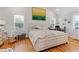Comfortable primary bedroom with hardwood floors, natural light, and a cozy atmosphere at 1598 Jonesboro Se Rd, Atlanta, GA 30315