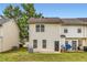 Back of home featuring vinyl siding and a grassy backyard at 1785 Fielding Way, Hampton, GA 30228