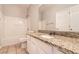 Bathroom featuring tub-shower,granite countertop and white cabinets at 1785 Fielding Way, Hampton, GA 30228