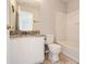 Bathroom featuring granite countertop, white cabinets and tiled floor at 1785 Fielding Way, Hampton, GA 30228