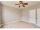 Bedroom featuring tile floor, ceiling fan and painted in a neutral color at 1785 Fielding Way, Hampton, GA 30228