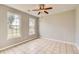 Bright bedroom with large windows and tile flooring, offering a serene living space at 1785 Fielding Way, Hampton, GA 30228