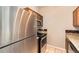 Well-equipped kitchen featuring stainless steel appliances, granite counters, and wood cabinetry at 1785 Fielding Way, Hampton, GA 30228