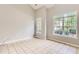 Spacious living room with tile flooring, plenty of light and neutral paint to compliment your furnishings at 1785 Fielding Way, Hampton, GA 30228
