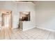 Bright living room with tile flooring, high ceilings, and a breakfast bar overlooking the kitchen at 1785 Fielding Way, Hampton, GA 30228