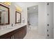 Spacious bathroom featuring double sinks, granite countertops and marble tile flooring at 3630 Peachtree Rd # 1909, Atlanta, GA 30326