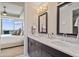 Modern bathroom featuring double sinks with granite countertops, tile and an open bedroom at 3630 Peachtree Rd # 1909, Atlanta, GA 30326
