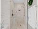 Modern shower featuring marble tiles, a rainfall showerhead and decorative greenery at 3630 Peachtree Rd # 1909, Atlanta, GA 30326