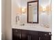 Modern bathroom featuring a marble countertop and stylish vanity at 3630 Peachtree Rd # 1909, Atlanta, GA 30326