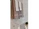 Luxurious bathroom featuring marble tile and a set of elegant towels at 3630 Peachtree Rd # 1909, Atlanta, GA 30326