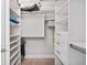 Spacious walk-in closet with ample storage space, shelving and drawers at 3630 Peachtree Rd # 1909, Atlanta, GA 30326