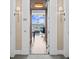 Hallway view into a modern, open-concept living space with floor-to-ceiling windows and stylish furnishings at 3630 Peachtree Rd # 1909, Atlanta, GA 30326