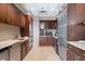 Well-equipped kitchenette featuring stainless steel appliances, custom cabinets, and ample counter space at 3630 Peachtree Rd # 1909, Atlanta, GA 30326