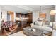 Open living room with a modern kitchen, an american flag and lots of seating at 3630 Peachtree Rd # 1909, Atlanta, GA 30326