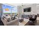 Inviting living room with a plush sofa, stylish furnishings, and a large window showcasing scenic views at 3630 Peachtree Rd # 1909, Atlanta, GA 30326