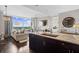 Open-concept living space featuring a gourmet kitchen, hardwood floors, and a sun-filled living room with floor-to-ceiling windows at 3630 Peachtree Rd # 1909, Atlanta, GA 30326