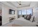 Bright main bedroom with sliding doors to a balcony and stunning nature views at 3630 Peachtree Rd # 1909, Atlanta, GA 30326