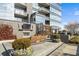 Relax on the expansive rooftop deck with an outdoor fireplace, custom seating and manicured landscaping at 3630 Peachtree Rd # 1909, Atlanta, GA 30326
