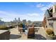 Enjoy city views from the rooftop deck featuring an outdoor fireplace and comfortable lounge seating at 3630 Peachtree Rd # 1909, Atlanta, GA 30326