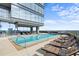 Luxury rooftop pool with comfortable lounge chairs and city views at 3630 Peachtree Rd # 1909, Atlanta, GA 30326