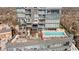 Upscale rooftop amenity deck featuring a swimming pool, lounge seating, grilling area, and green space for relaxation at 3630 Peachtree Rd # 1909, Atlanta, GA 30326