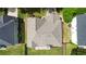 Aerial view of the home, showcasing a well-maintained grey roof and a partially fenced backyard at 7325 Thoreau Cir, Atlanta, GA 30349