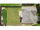 Aerial view of a fenced backyard, patio, and home with a grey roof at 7325 Thoreau Cir, Atlanta, GA 30349