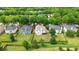 An aerial view of a neighborhood with fenced-in backyards and well-maintained lawns, providing privacy and space at 7325 Thoreau Cir, Atlanta, GA 30349