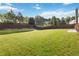 Expansive, well-manicured backyard featuring lush green grass and a partial wooden fence, perfect for outdoor enjoyment at 7325 Thoreau Cir, Atlanta, GA 30349