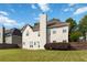 The backyard features a well-maintained lawn, partial wooden fence, and a door leading into the home at 7325 Thoreau Cir, Atlanta, GA 30349