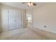 Neutral bedroom with double closets and an open doorway to the hallway at 7325 Thoreau Cir, Atlanta, GA 30349