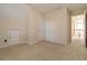 Neutral bedroom featuring a built-in storage area and a doorway to the hallway at 7325 Thoreau Cir, Atlanta, GA 30349