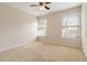 Standard bedroom with neutral carpet, beige walls, and two windows at 7325 Thoreau Cir, Atlanta, GA 30349