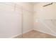 Walk-in closet with wire shelving, beige carpeting, and freshly painted walls at 7325 Thoreau Cir, Atlanta, GA 30349